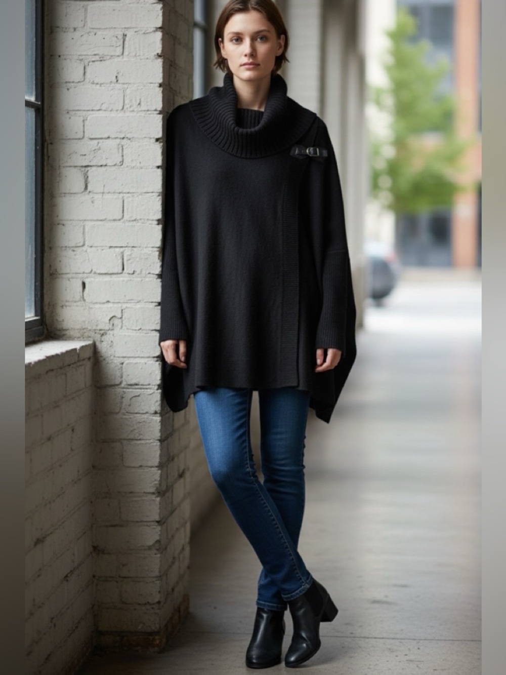 Ladies Calvin Klein black sweater with a gold tone fastener size S/M cowl neck